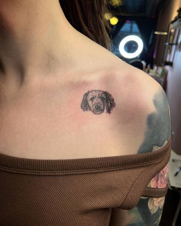 62 Beautiful Remembrance Tattoos for Dogs: A Heartfelt Tribute 34 Tiny realistic dog face memorial tattoo on shoulder blade