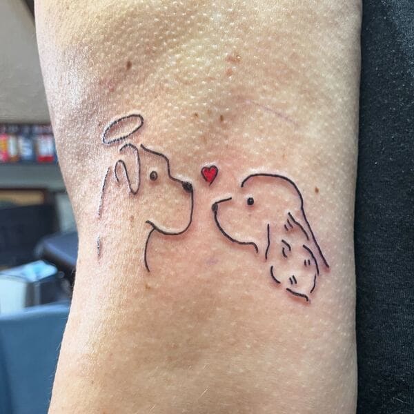 62 Beautiful Remembrance Tattoos for Dogs: A Heartfelt Tribute 21 Two dog profiles facing each other with tiny red heart minimalist memorial tattoo