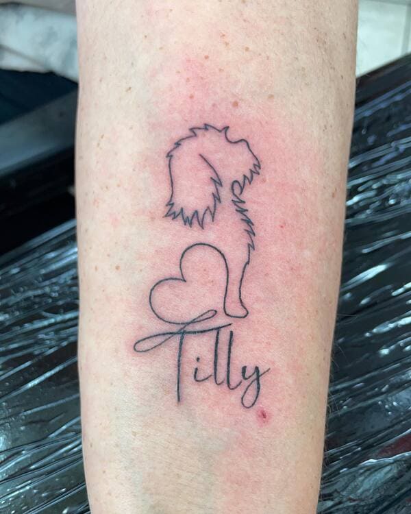 62 Beautiful Remembrance Tattoos for Dogs: A Heartfelt Tribute 23 Custom dog silhouette with heart and name 'Tilly' memorial tattoo desig