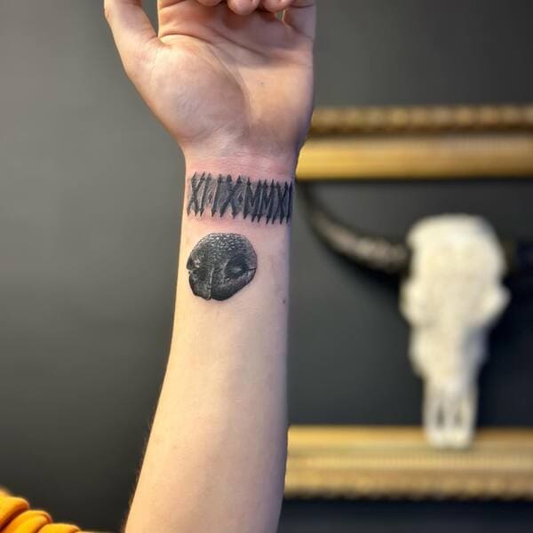 62 Beautiful Remembrance Tattoos for Dogs: A Heartfelt Tribute 49 Realistic black dog nose memorial tattoo with pattern on wris