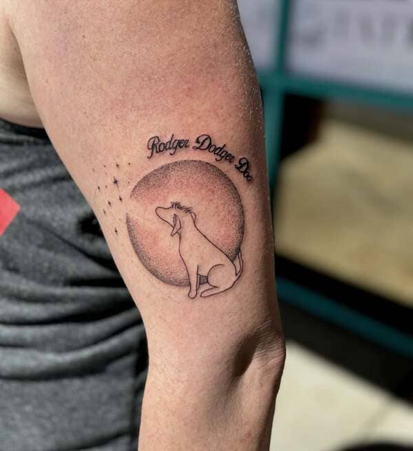 62 Beautiful Remembrance Tattoos for Dogs: A Heartfelt Tribute 60 Dog silhouette howling at moon memorial tattoo with name Rodger Dodge Dog