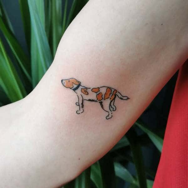 62 Beautiful Remembrance Tattoos for Dogs: A Heartfelt Tribute 31 Small orange and white spotted dog memorial tattoo in watercolor style on inner arm