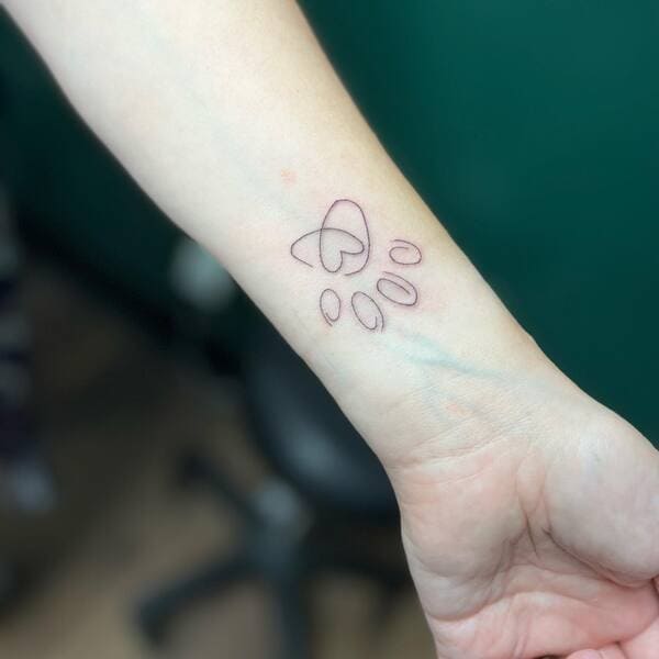 62 Beautiful Remembrance Tattoos for Dogs: A Heartfelt Tribute 51 Minimalist heart paw print outline memorial tattoo on inner wris