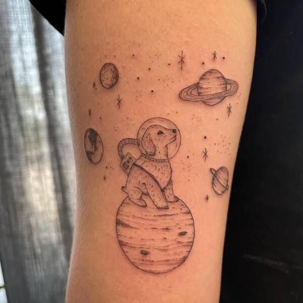 62 Beautiful Remembrance Tattoos for Dogs: A Heartfelt Tribute 62 Space themed dog astronaut memorial tattoo with planets and stars