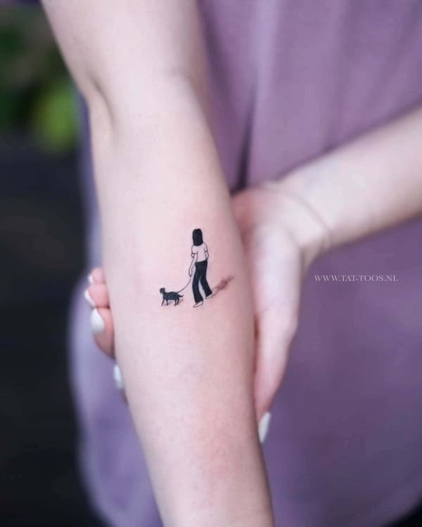 62 Beautiful Remembrance Tattoos for Dogs: A Heartfelt Tribute 2 Minimalist paw print dog memorial tattoo with delicate linework on inner forearm - Remembrance Tattoos for Dogs
